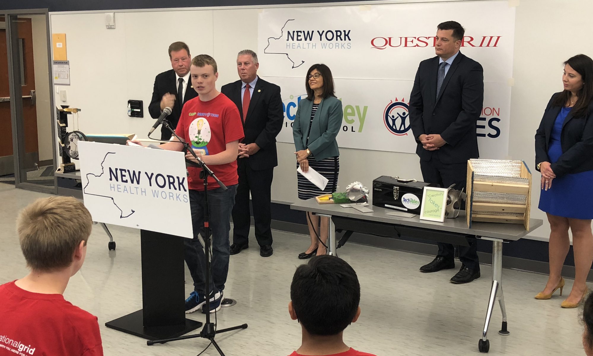 photo of student speaking at podium