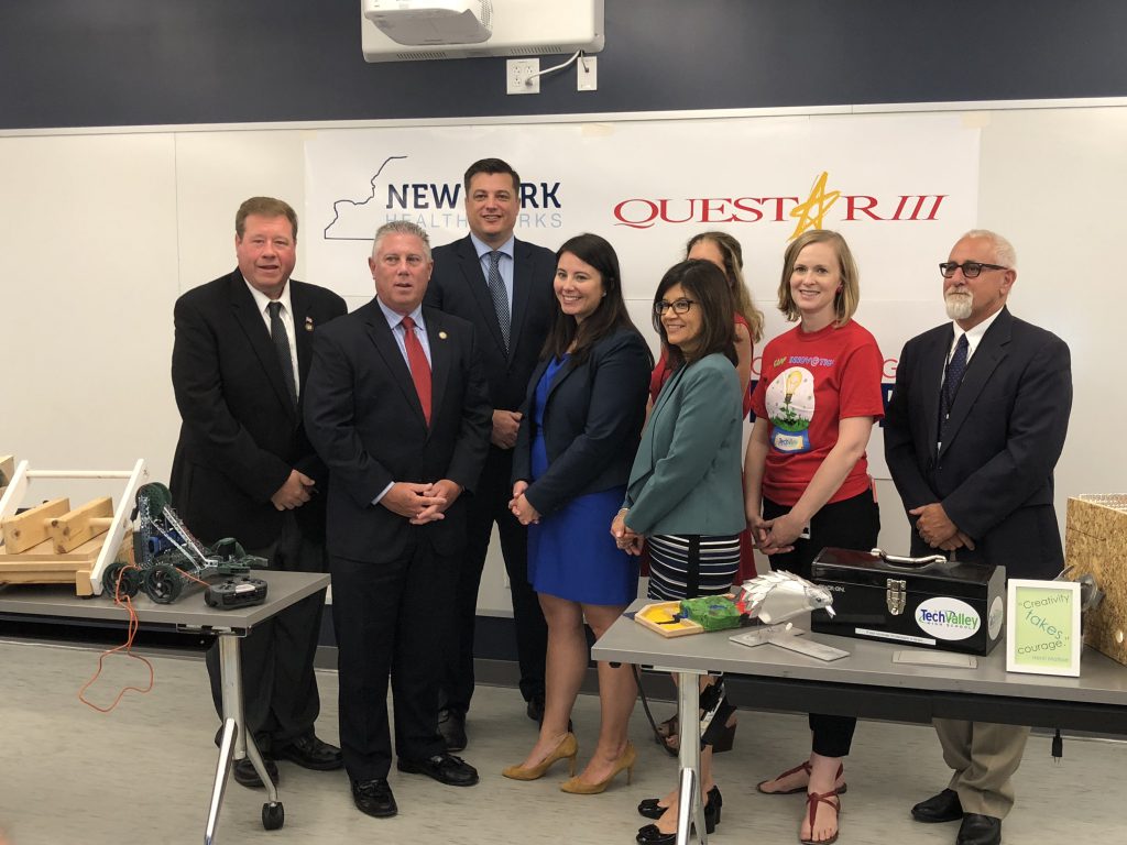 group photo of elected officials, school and business representatives.