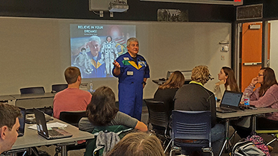 photo of astronaut speaking to students.