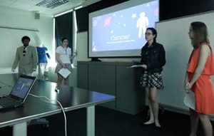 Photo of students presenting research to class