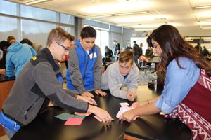 Photo of prospective students working with senior Farzana Musomi