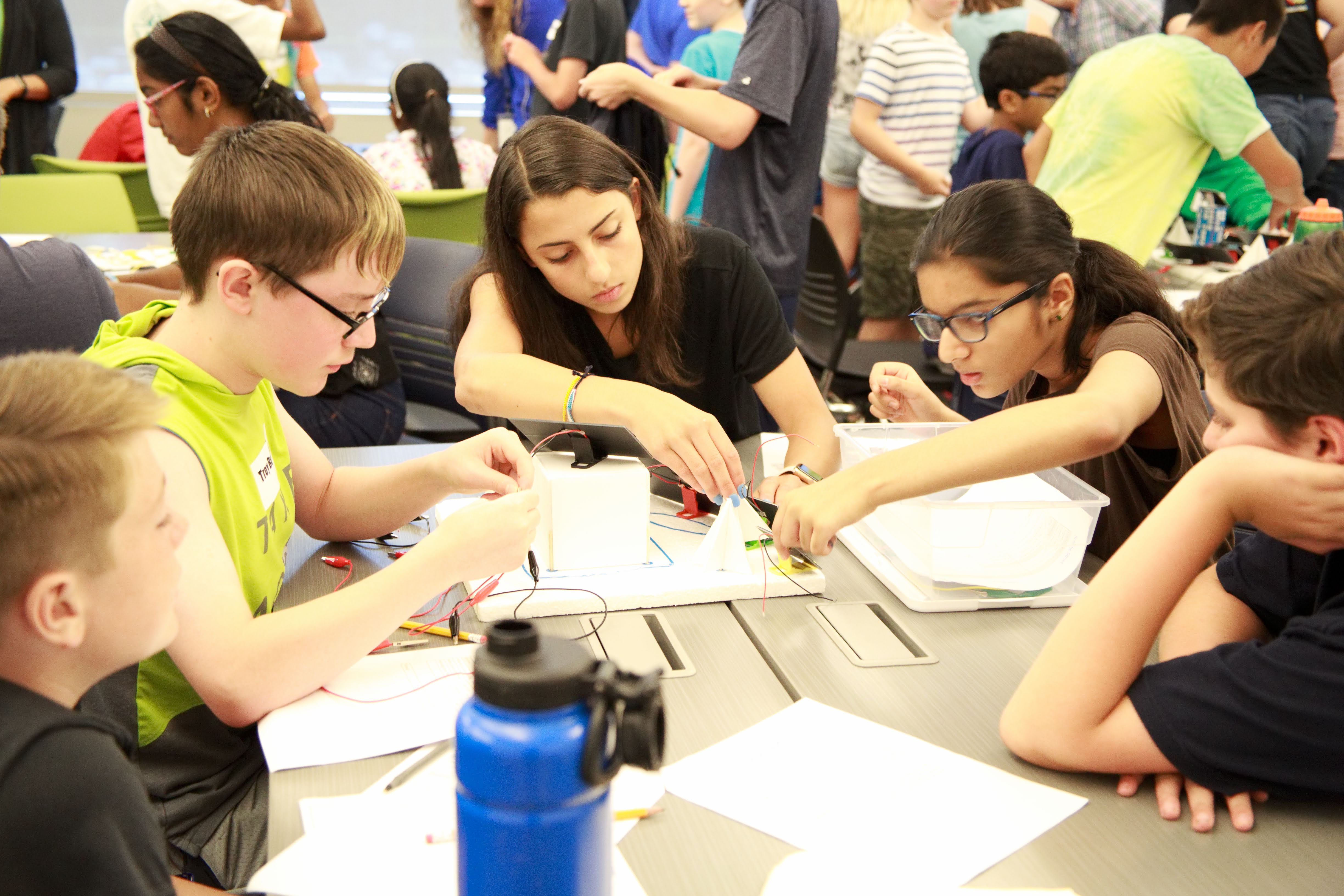 photo of students working on a group activity around a table